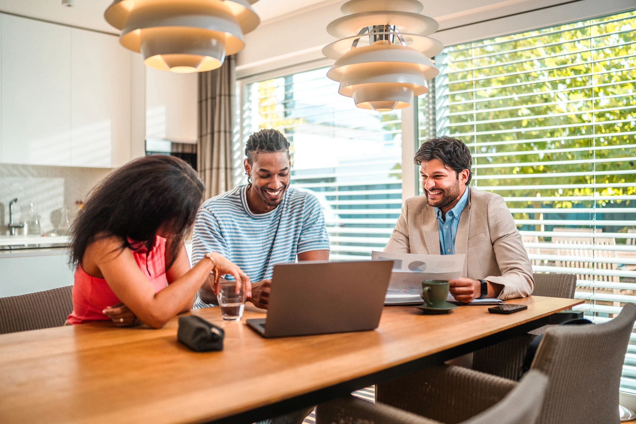 Financial advisor discussing documents with clients