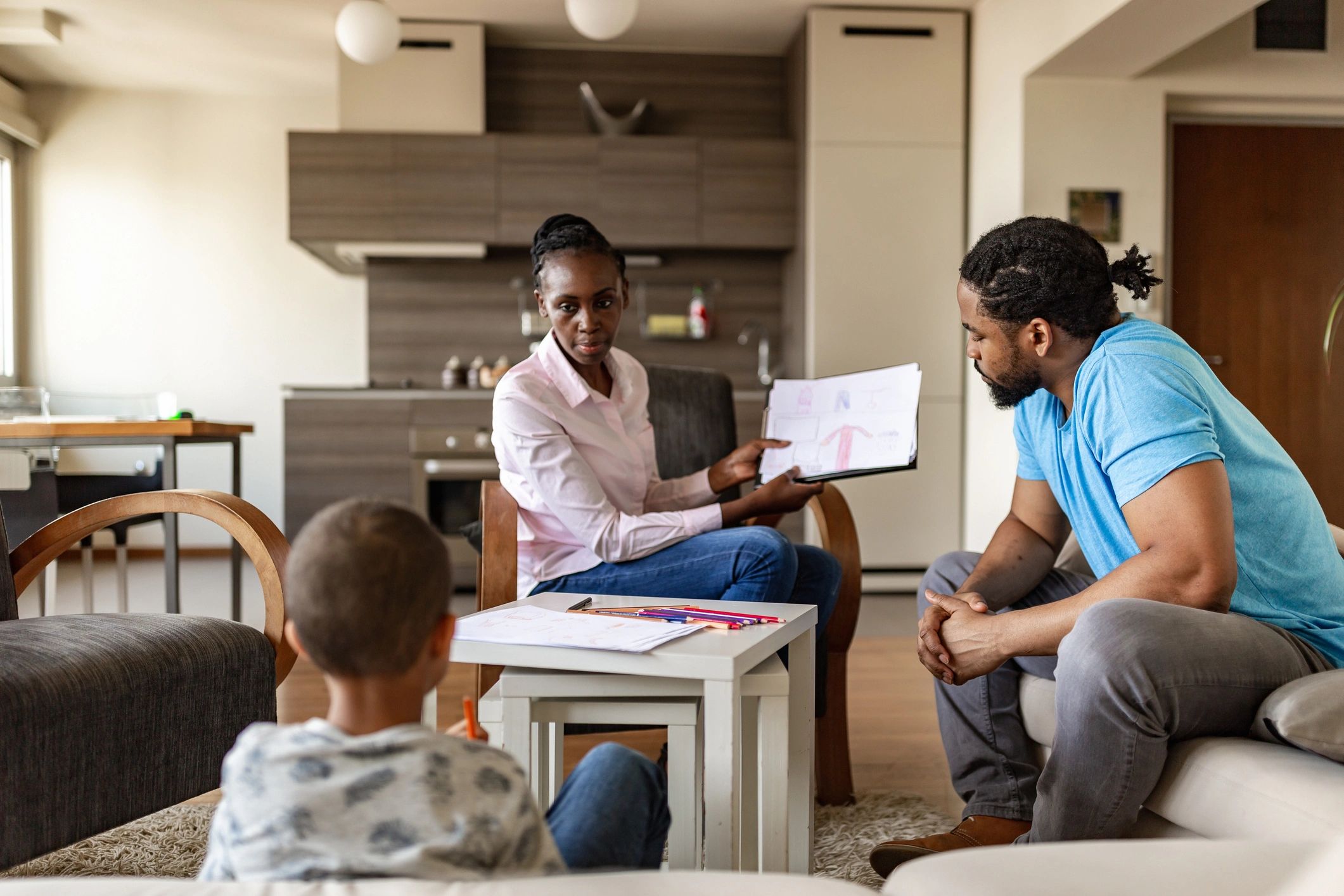 Family meeting with a financial advisor reviewing paperwork